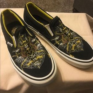 Vans  black & yellow trim w/skulls.
